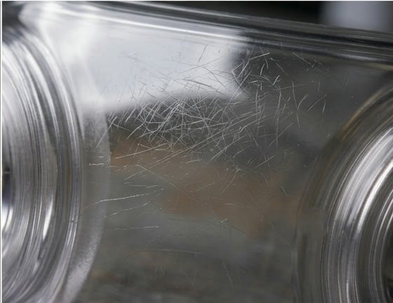 A dull, finely scratched plastic surface