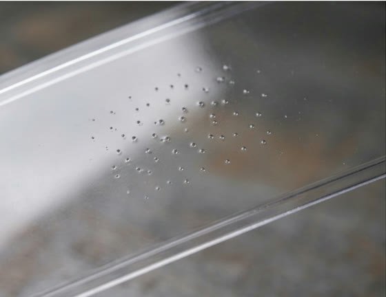 Pinholes scattered across a moulded plastic part